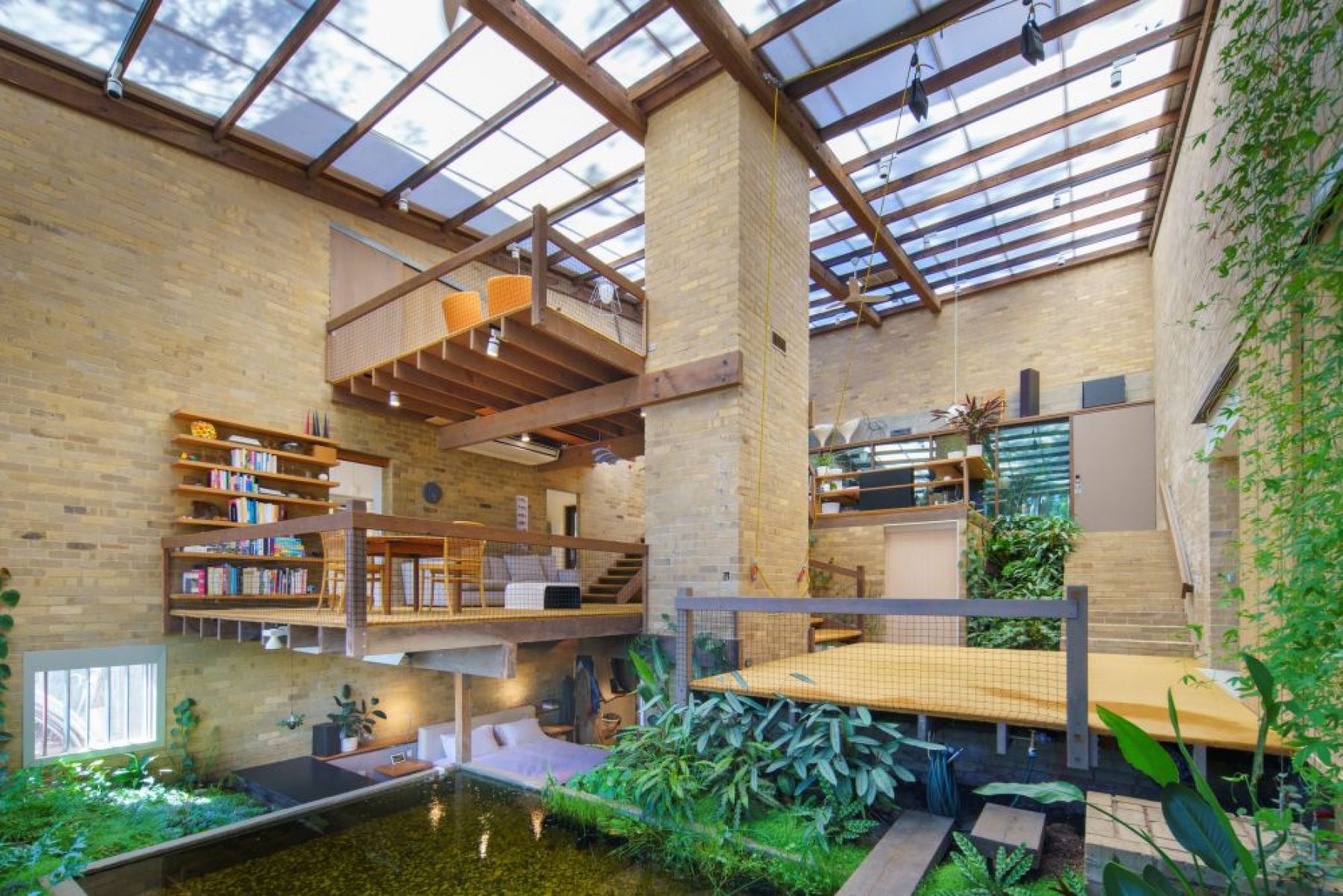A bright mid-century home of multilayered mezzanine floors.