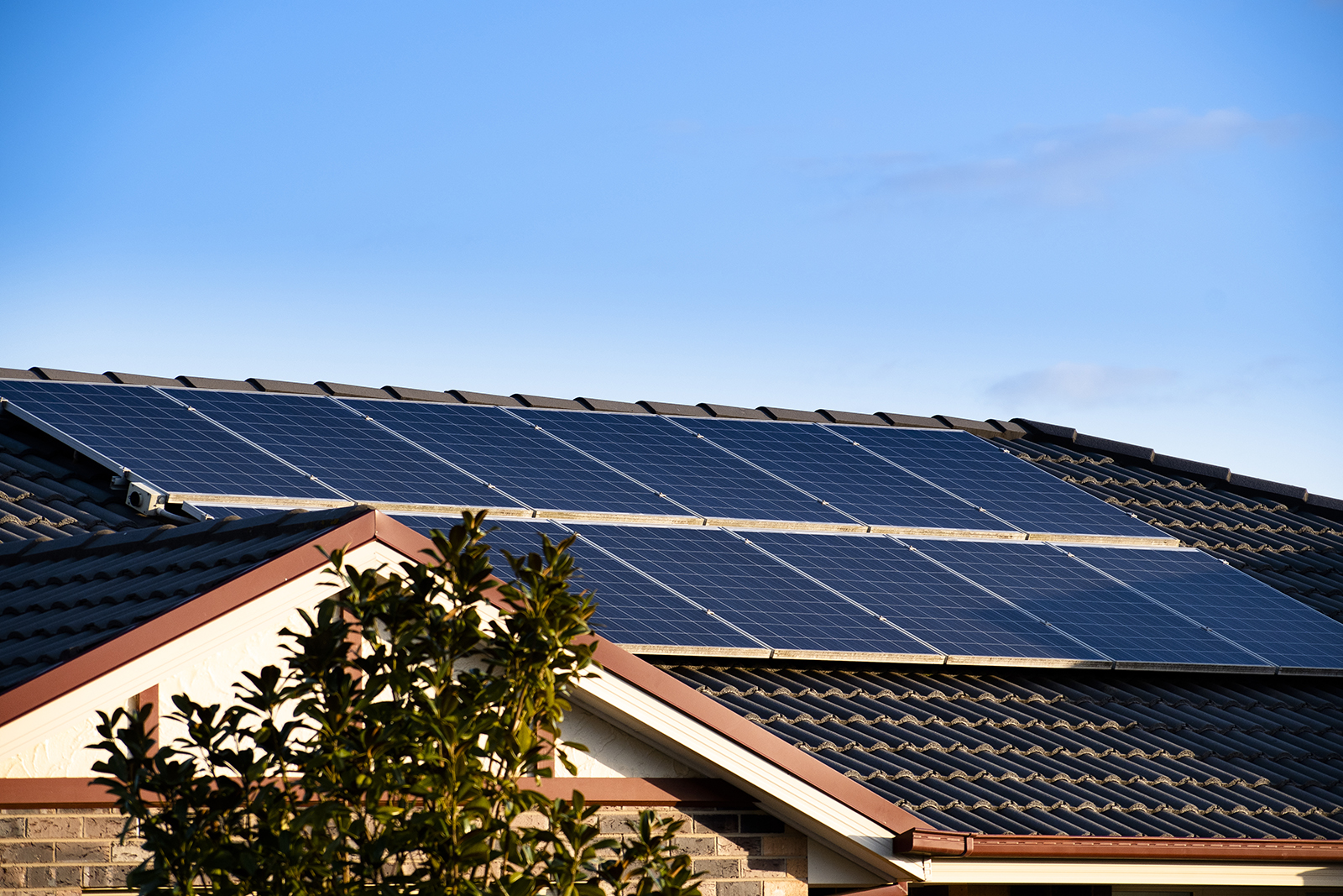 Photo of house roof with solar panels  