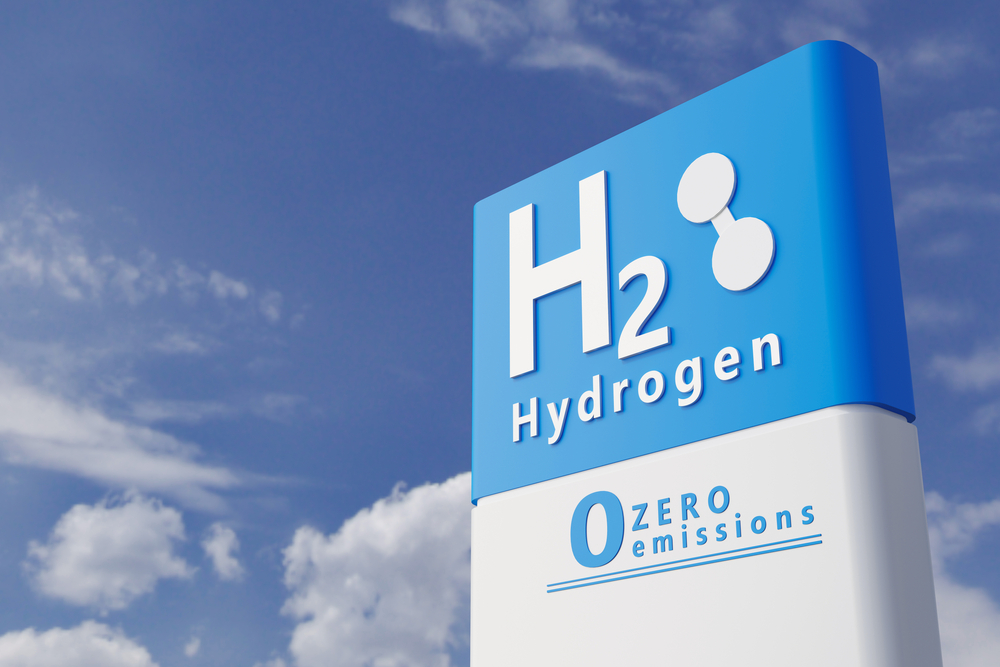 Hydrogen, zero emissions sign against blue sky  
