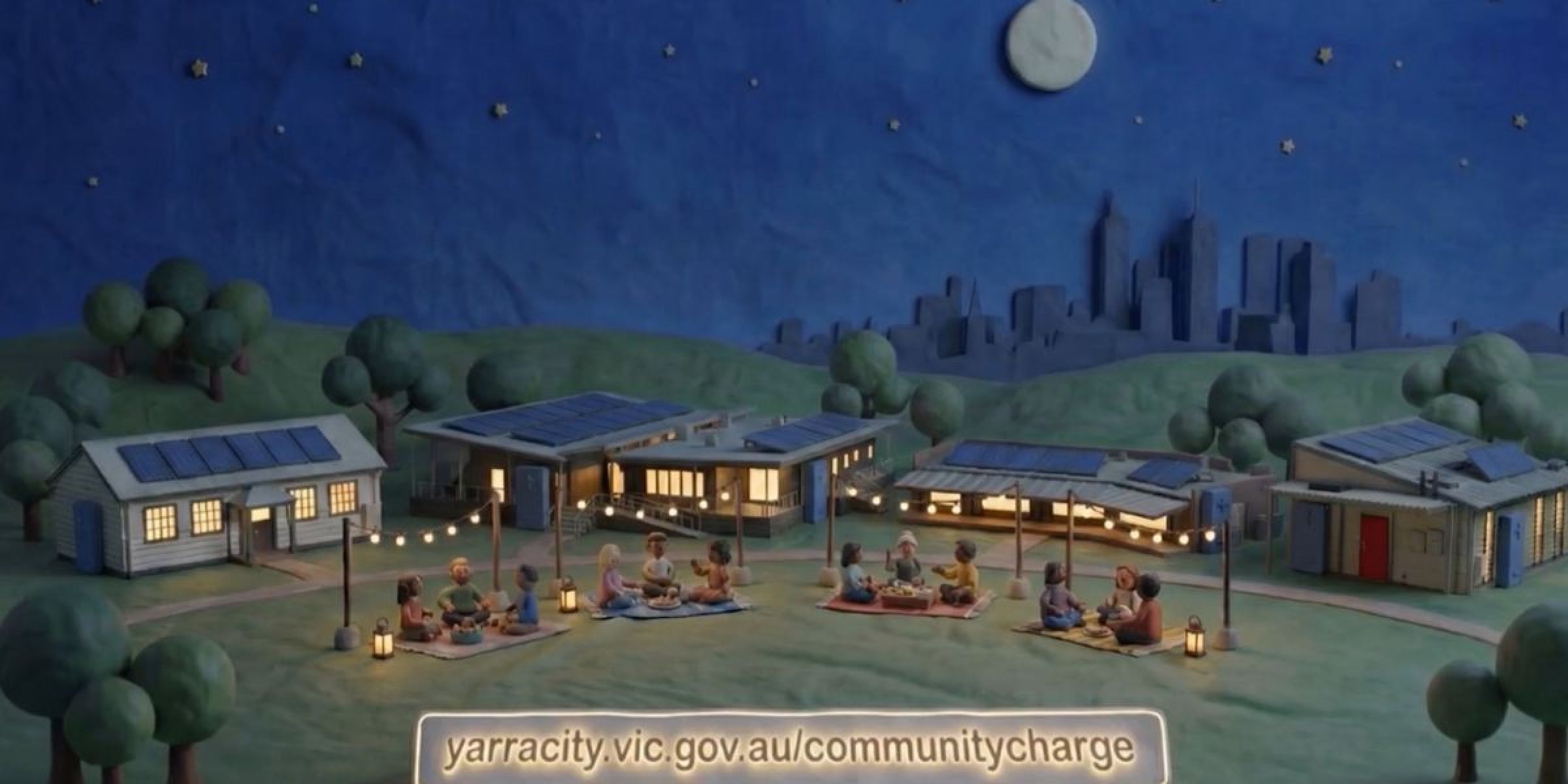 Still from the Yarra community charge video showing lit up buildings