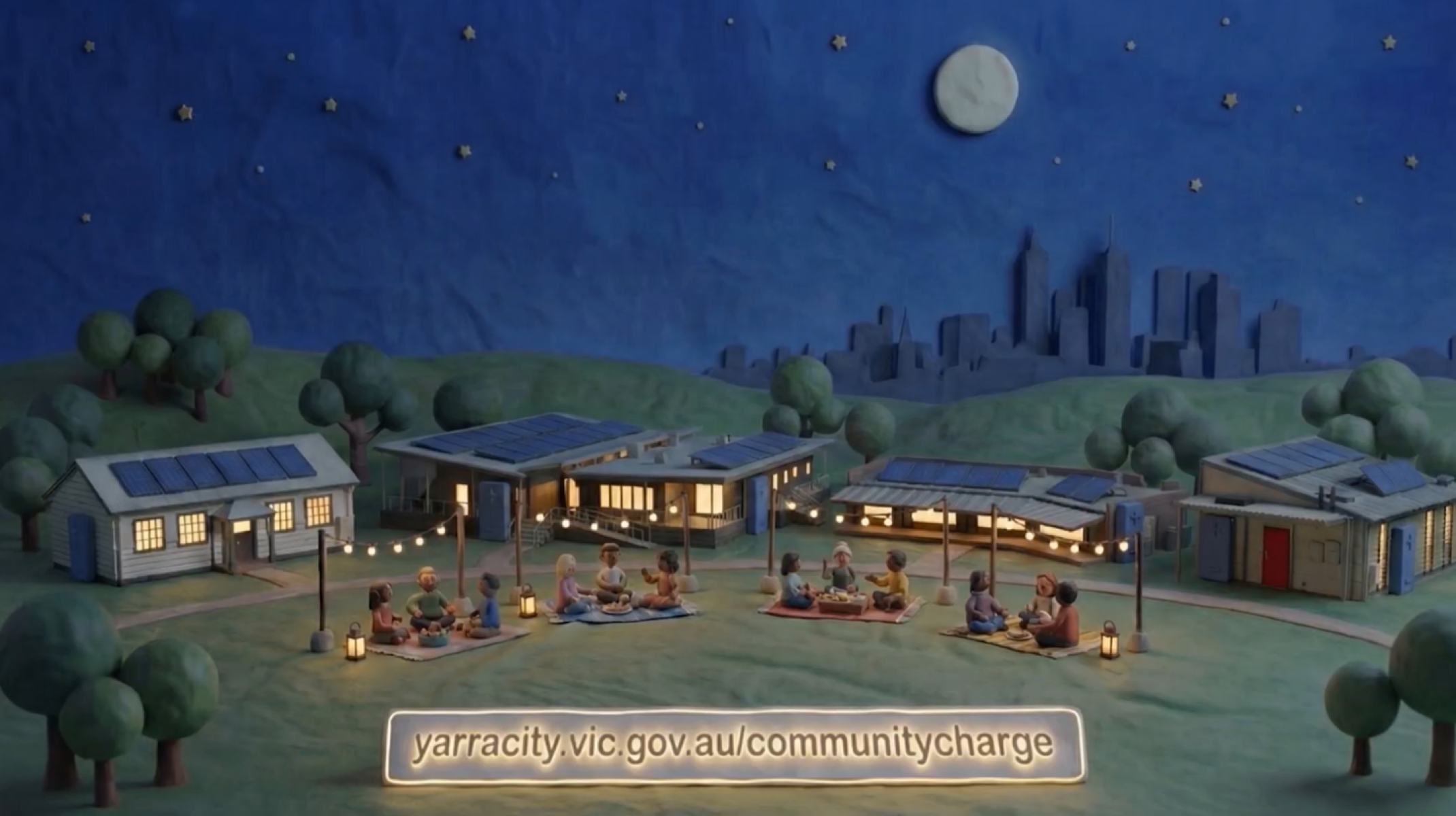 Still from the Yarra community charge video showing lit up buildings