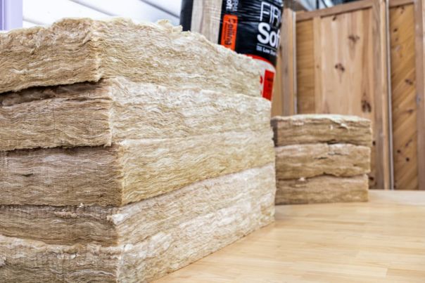 Stacks of ceiling insulation batts prepared for installation