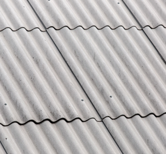 Asbestos cement sheet roofing