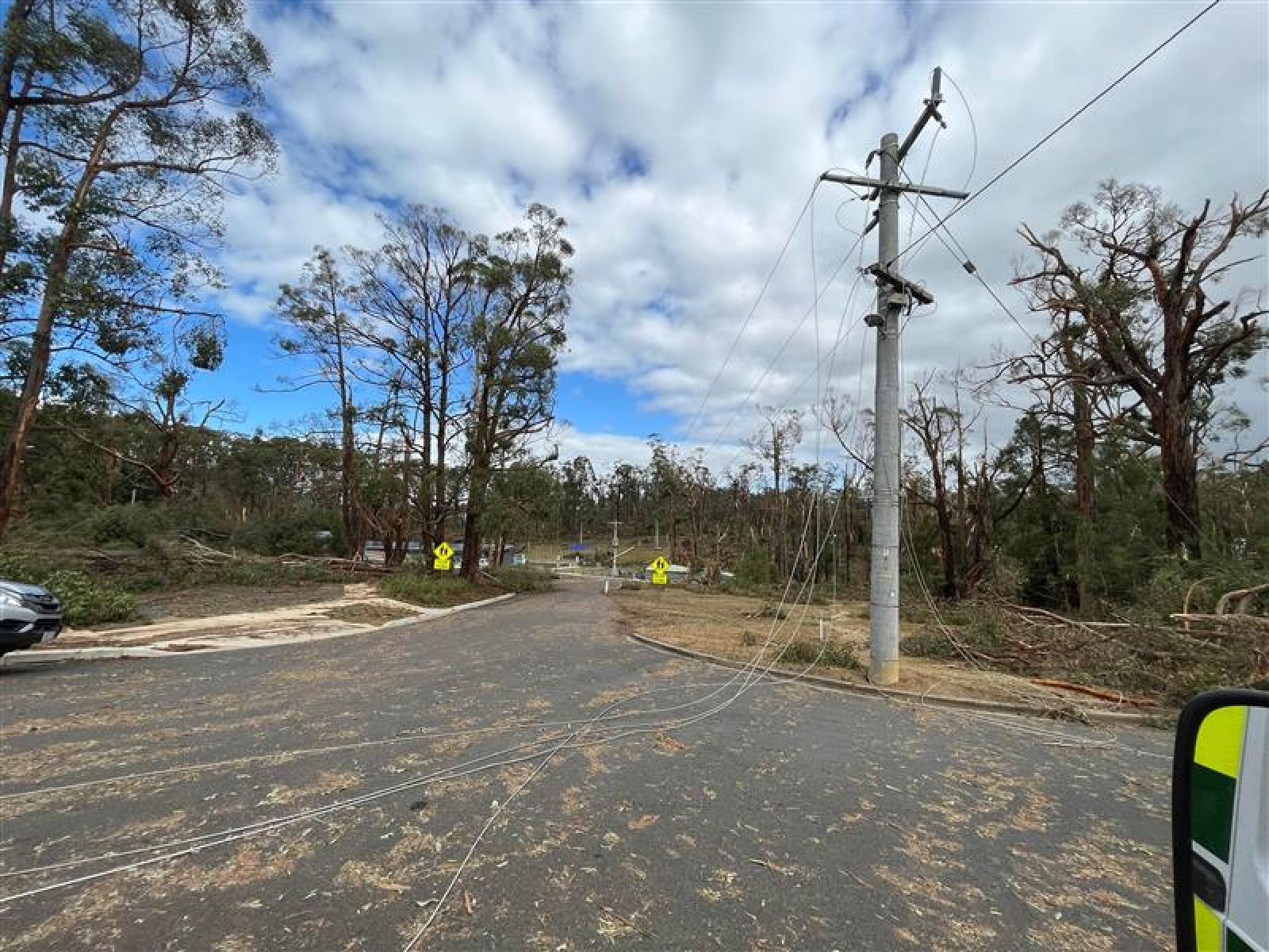 Photo of a powerline down over the road in a rural Victorian town