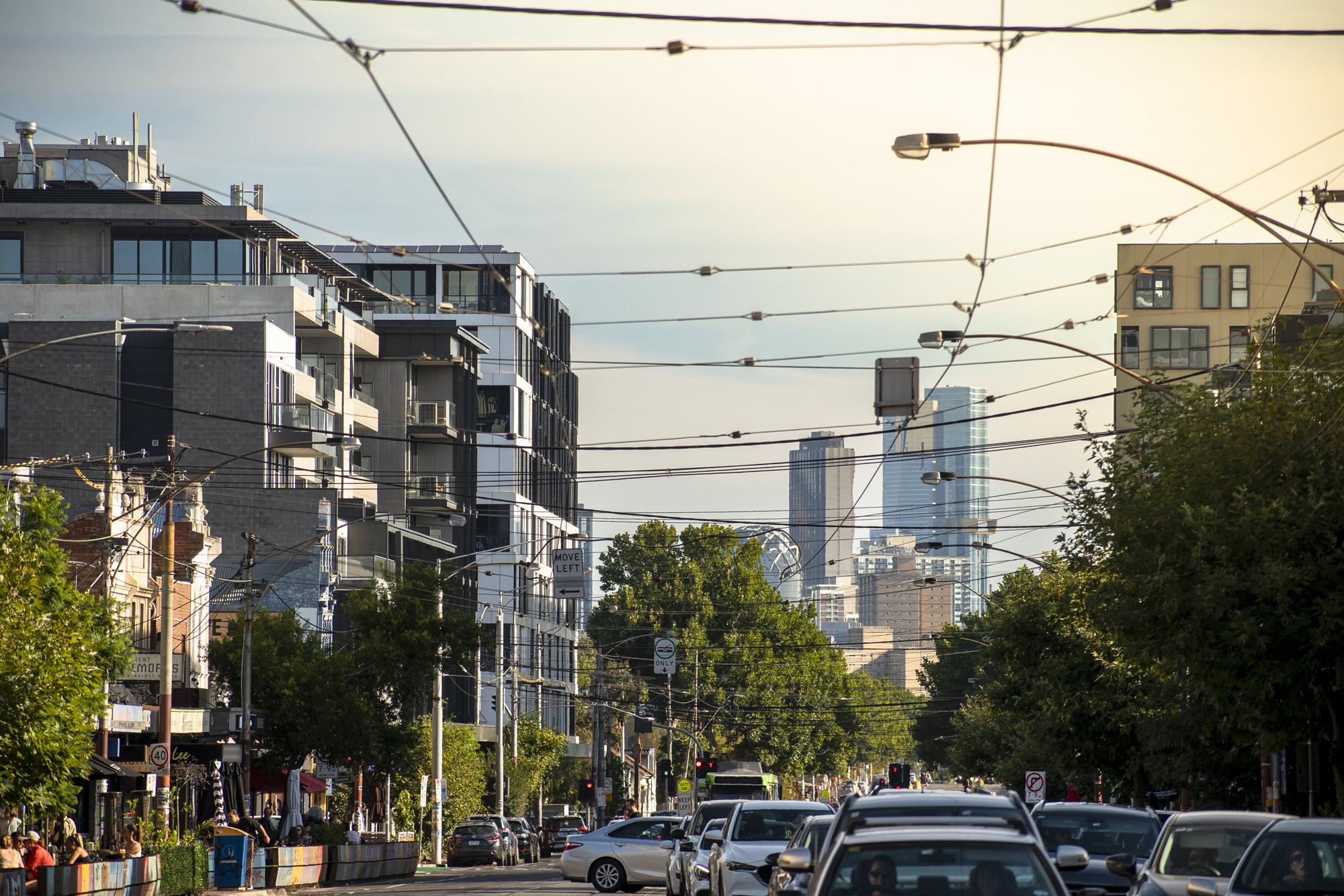 A suburban Melbourne street on a sunny day with the CBD in the background