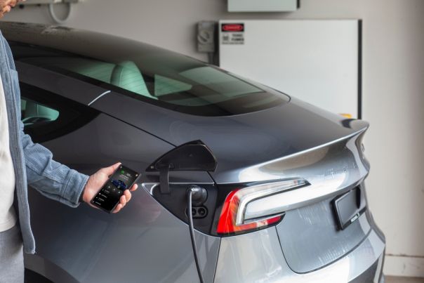 someone charging an EV vechicle